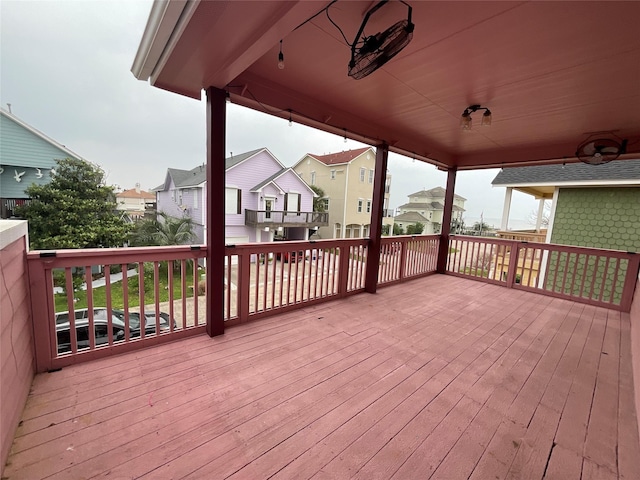 wooden deck with a residential view