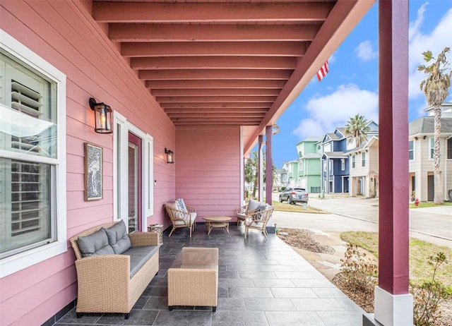 view of patio / terrace featuring a residential view and a porch