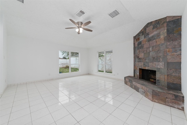 16123 Ridgegreen Dr, Houston, TX 77082 - unfurnished living room featuring light tile patterned floors, visible vents, a stone fireplace, and a ceiling fan
