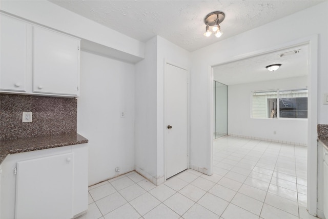 16123 Ridgegreen Dr, Houston, TX 77082 - interior space featuring visible vents, a textured ceiling, and light tile patterned flooring