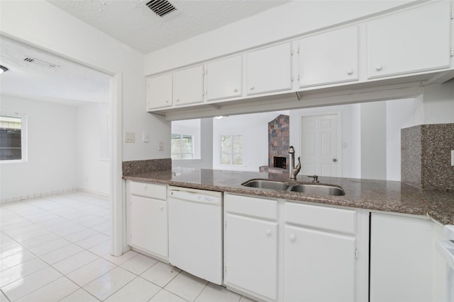 16123 Ridgegreen Dr, Houston, TX 77082 - kitchen with visible vents, dishwasher, light tile patterned flooring, white cabinets, and a sink