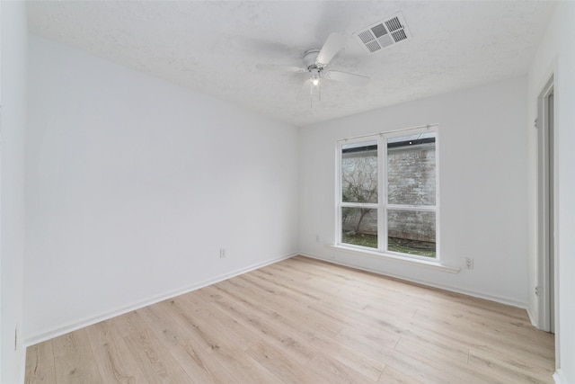 16123 Ridgegreen Dr, Houston, TX 77082 - spare room featuring a textured ceiling, visible vents, light wood finished floors, and ceiling fan