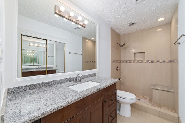 16123 Ridgegreen Dr, Houston, TX 77082 - full bathroom featuring visible vents, toilet, vanity, and a tile shower