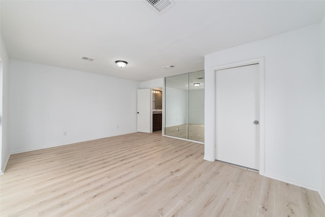 16123 Ridgegreen Dr, Houston, TX 77082 - unfurnished bedroom with light wood-style flooring, visible vents, and ensuite bathroom
