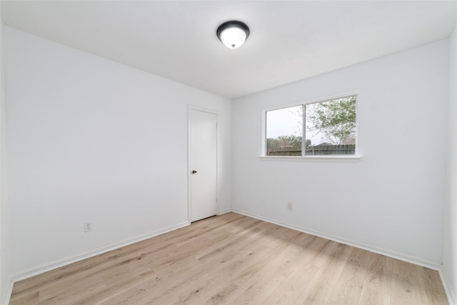 16123 Ridgegreen Dr, Houston, TX 77082 - unfurnished room with light wood-style floors and baseboards