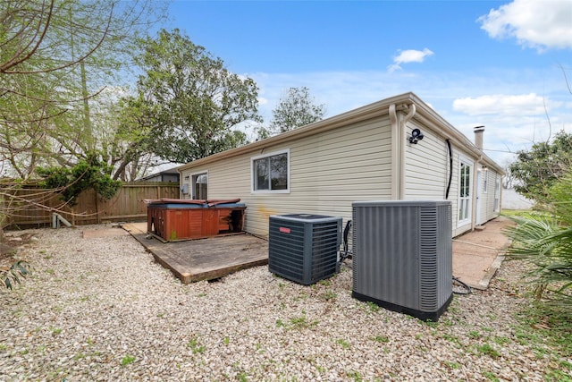 16123 Ridgegreen Dr, Houston, TX 77082 - back of property with a deck, central AC unit, fence, and a hot tub