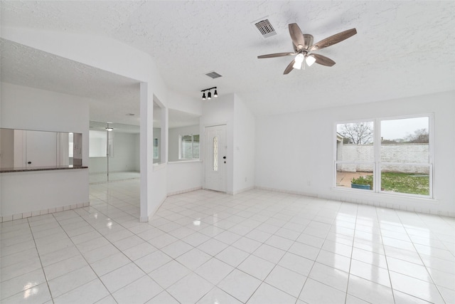 16123 Ridgegreen Dr, Houston, TX 77082 - unfurnished room featuring light tile patterned floors, visible vents, a textured ceiling, and a ceiling fan