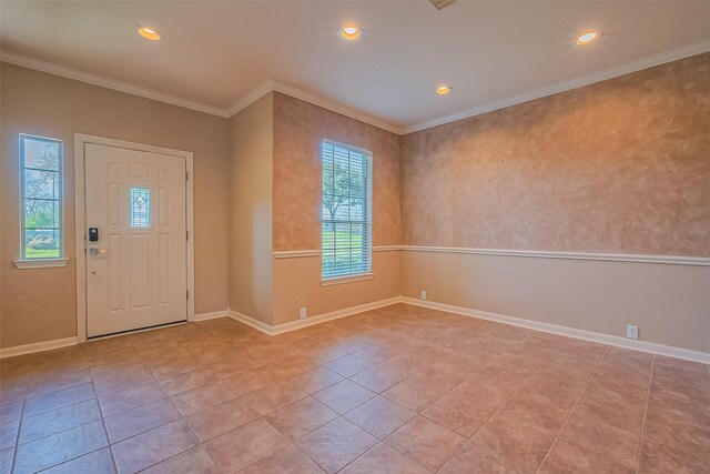foyer entrance featuring recessed lighting, tile patterned floors, ornamental molding, and baseboards