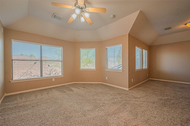 empty room with carpet flooring, a ceiling fan, and baseboards