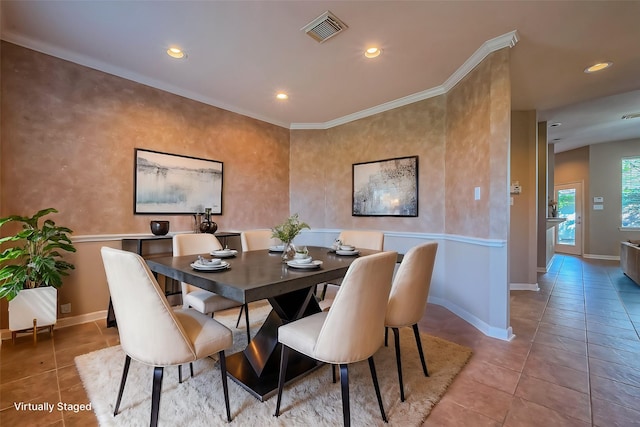 tiled dining room featuring recessed lighting, baseboards, and crown molding