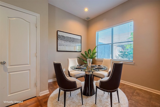 dining area with baseboards and recessed lighting