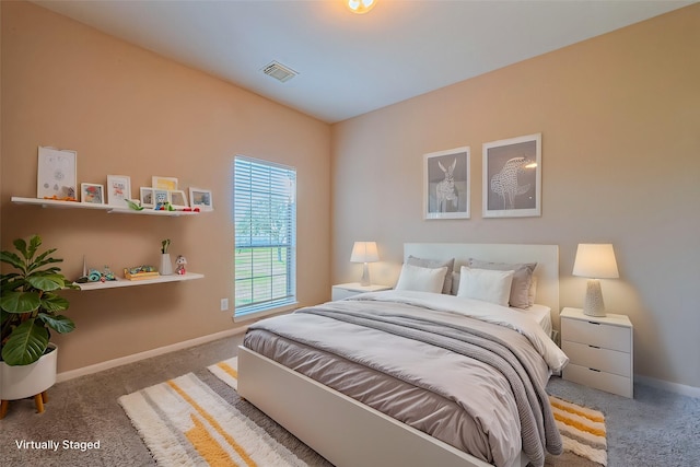 bedroom with carpet and baseboards