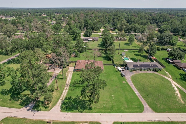 drone / aerial view featuring a view of trees