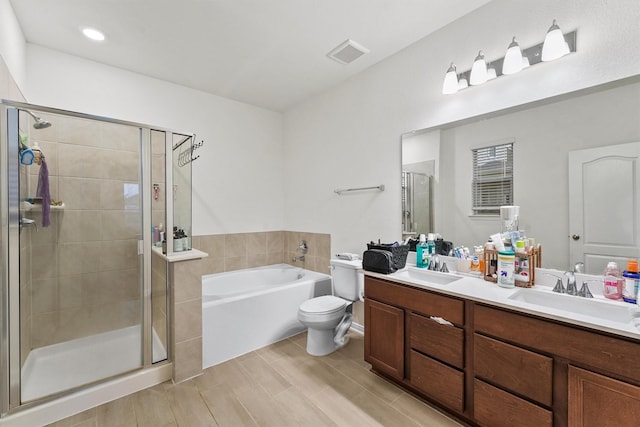 full bath with a garden tub, visible vents, a shower stall, and a sink