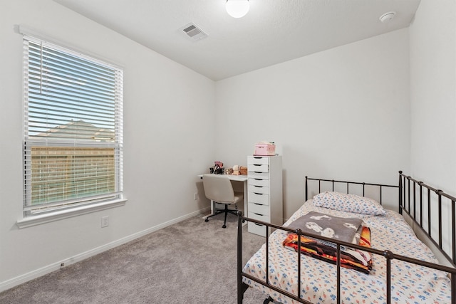 bedroom with visible vents, baseboards, and carpet floors