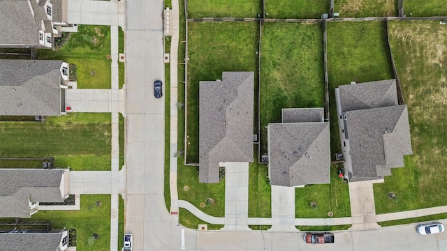 birds eye view of property with a residential view