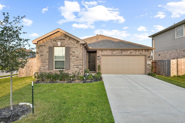 ranch-style home with brick siding, fence, a front yard, driveway, and an attached garage