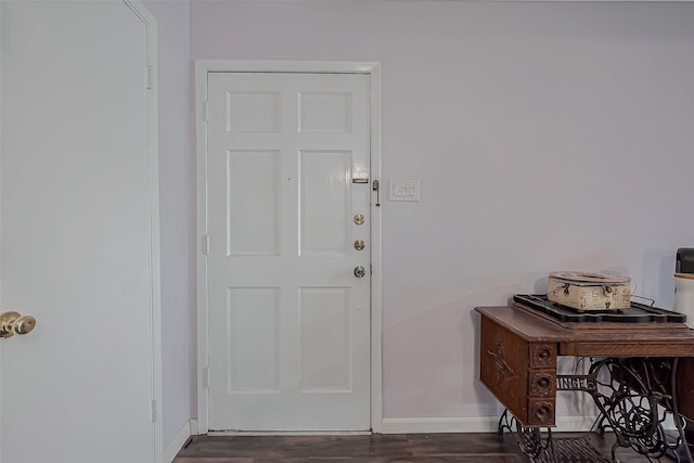 entrance foyer featuring dark wood-type flooring and baseboards