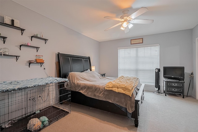 bedroom featuring light carpet and a ceiling fan