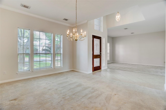 carpeted empty room with visible vents, baseboards, and a notable chandelier