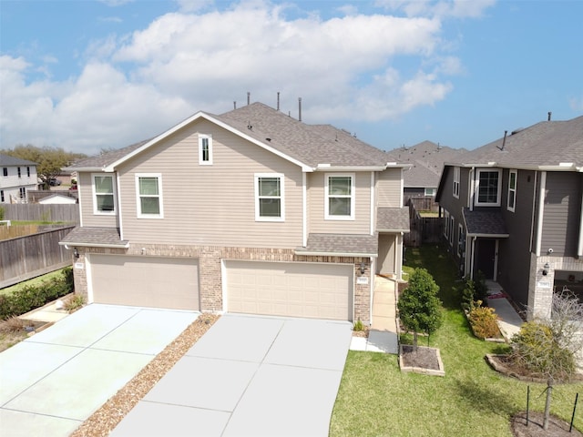 view of front of home with a garage, concrete driveway, roof with shingles, and fence