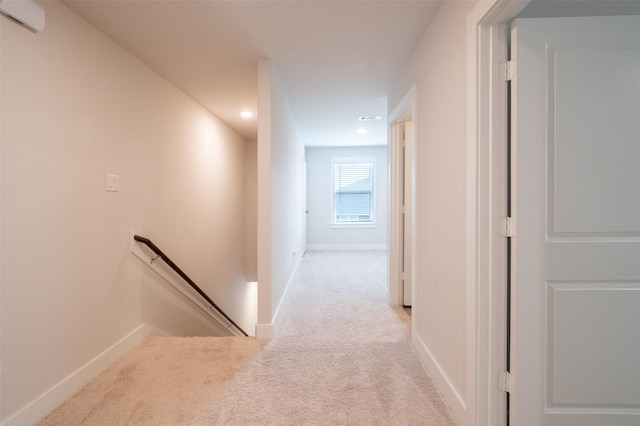 corridor featuring an upstairs landing, recessed lighting, baseboards, and carpet