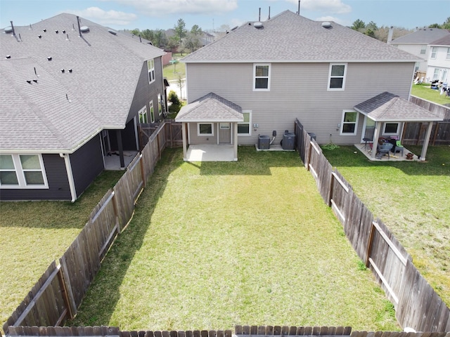 rear view of property with a patio, cooling unit, and a fenced backyard