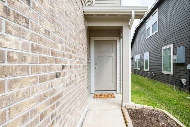 property entrance with brick siding