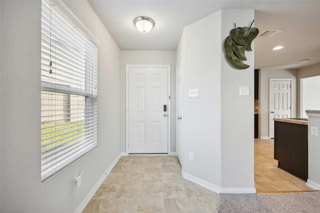 entrance foyer featuring visible vents and baseboards