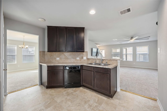 kitchen featuring visible vents, a sink, black dishwasher, a peninsula, and light colored carpet