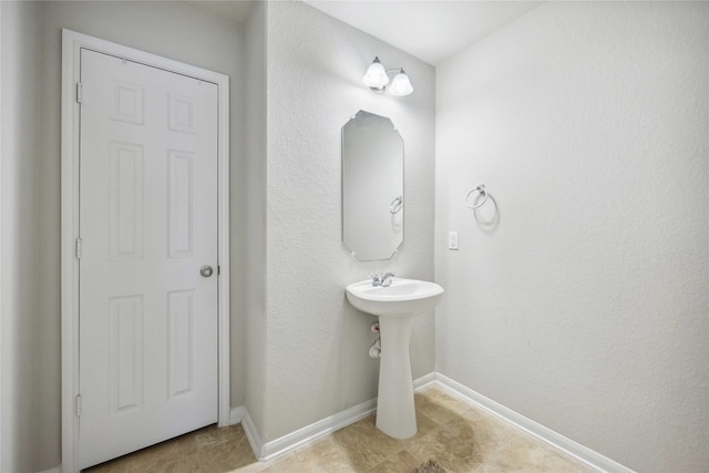 bathroom featuring baseboards