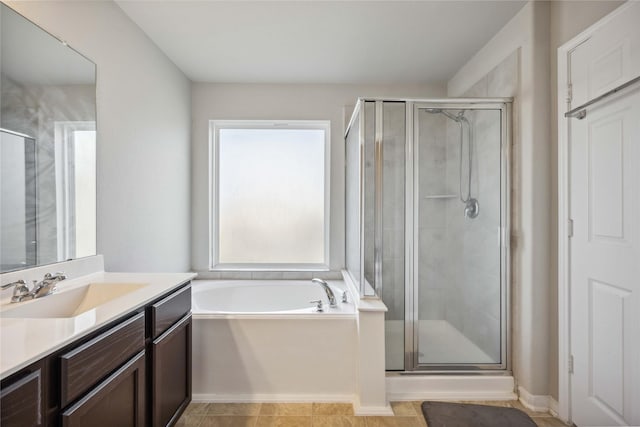 full bath featuring vanity, a shower stall, and a bath