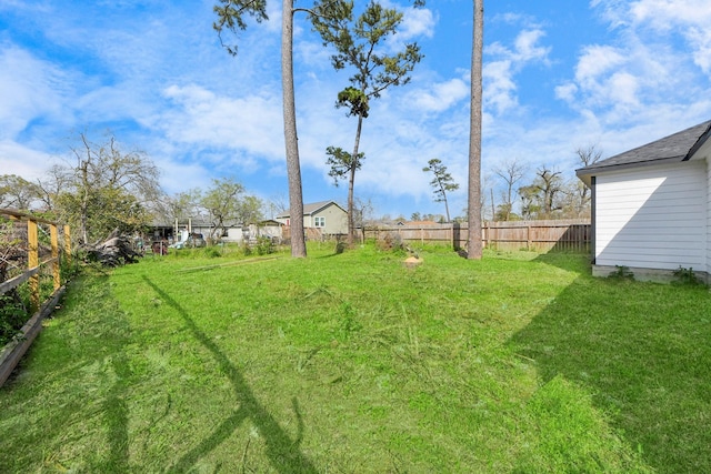 view of yard featuring a fenced backyard
