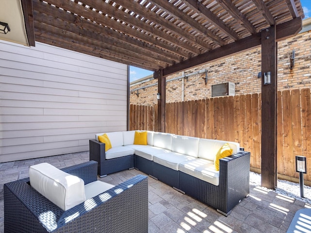 view of patio / terrace with an outdoor hangout area, a pergola, and fence