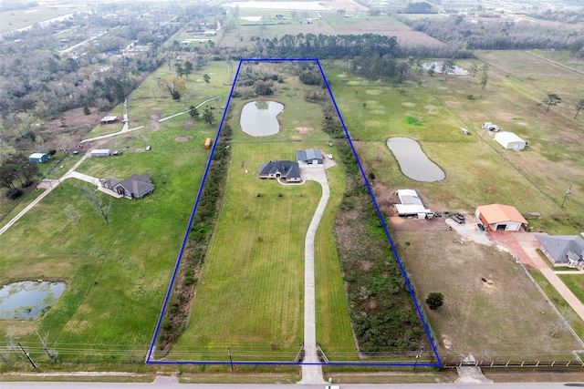 birds eye view of property featuring a rural view