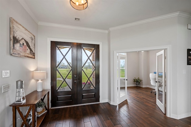 entryway with visible vents, crown molding, baseboards, dark wood finished floors, and french doors