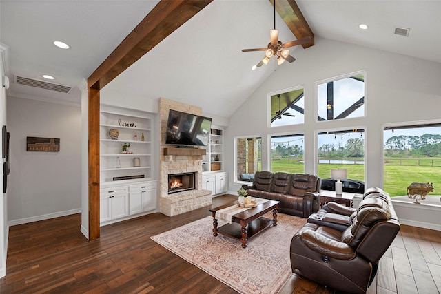 living room with dark wood finished floors, visible vents, plenty of natural light, and beamed ceiling