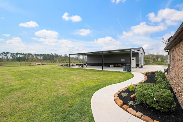 view of yard featuring a patio and fence