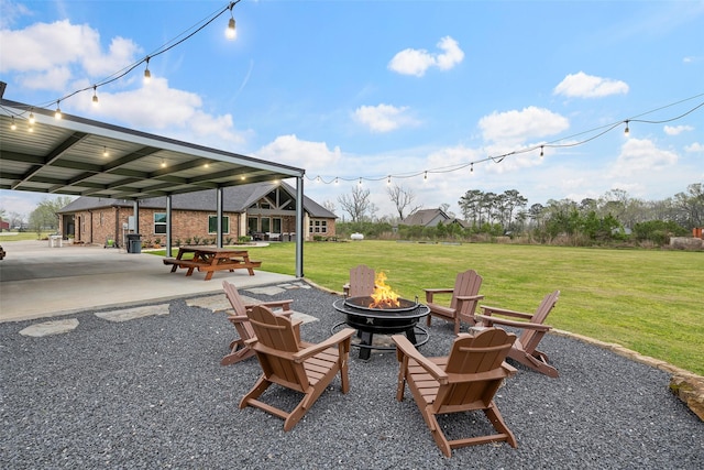 view of yard featuring a patio and a fire pit