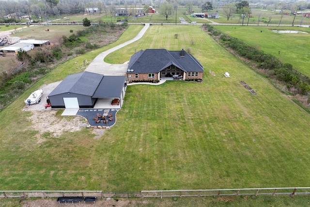 birds eye view of property with a rural view