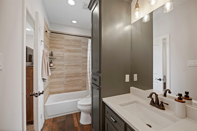 bathroom featuring shower / tub combo with curtain, toilet, wood finished floors, recessed lighting, and vanity