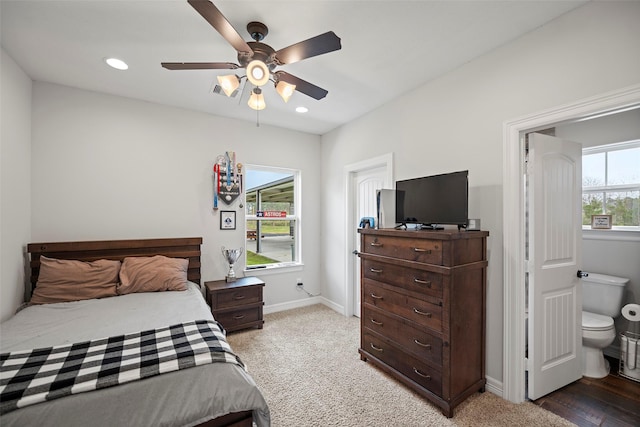 carpeted bedroom featuring a ceiling fan, visible vents, recessed lighting, and baseboards