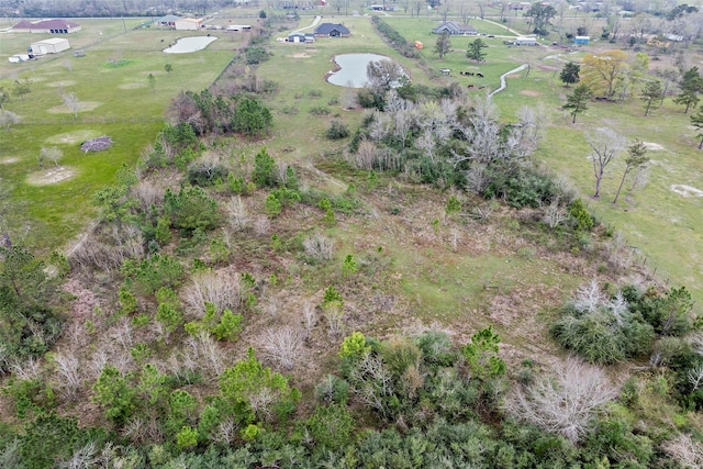 birds eye view of property with a rural view