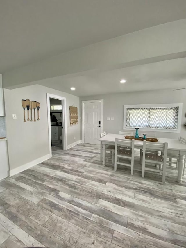 unfurnished dining area featuring recessed lighting, baseboards, and light wood finished floors