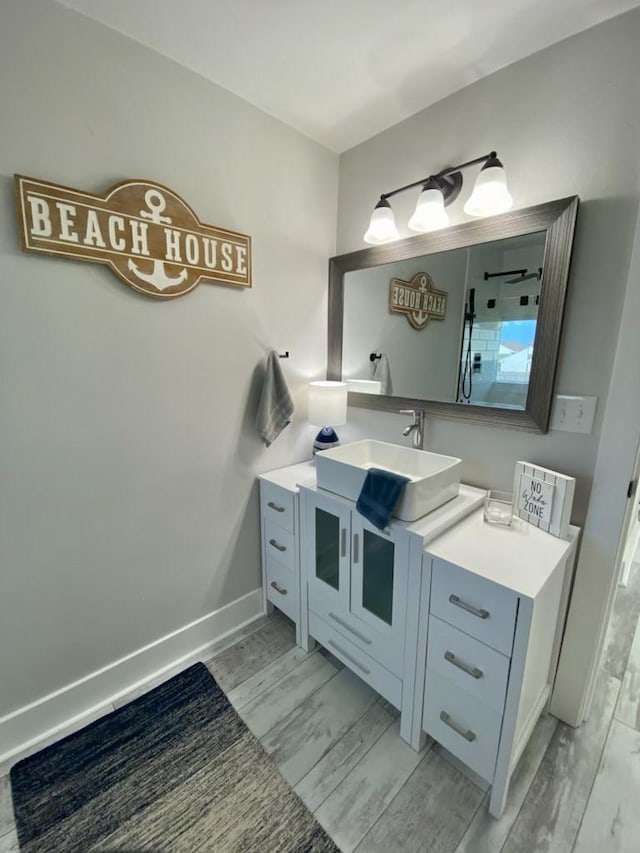 bathroom featuring vanity and baseboards