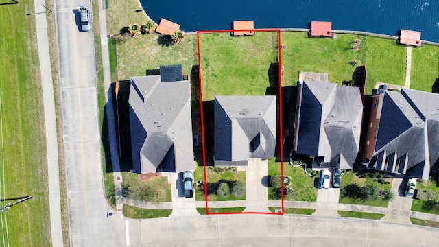 birds eye view of property featuring a water view