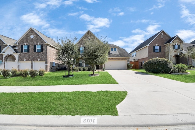 view of front of house with a front lawn, a garage, and driveway