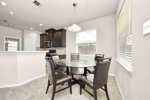 dining space featuring recessed lighting, visible vents, baseboards, and light tile patterned flooring