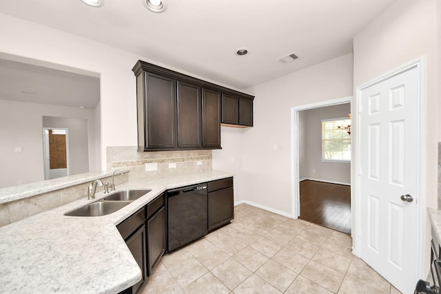 kitchen with visible vents, a sink, light countertops, dark brown cabinetry, and black dishwasher