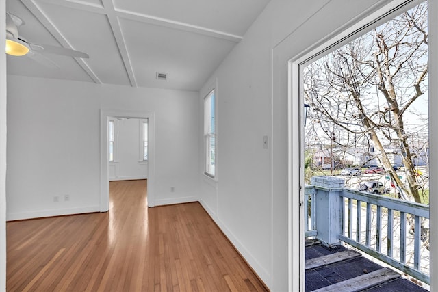 entrance foyer with a ceiling fan, light wood-type flooring, and baseboards